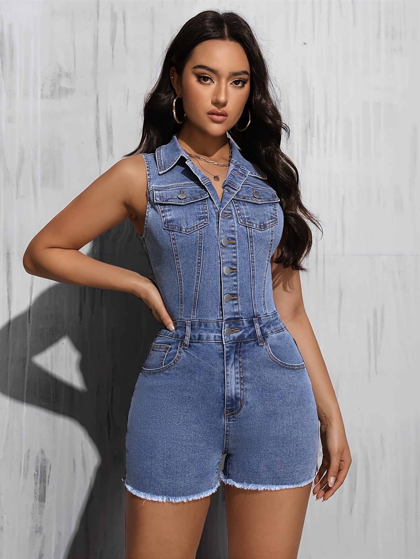 Women's Casual Blue Washed Denim Romper with Frayed Hem and Button-Down Front.